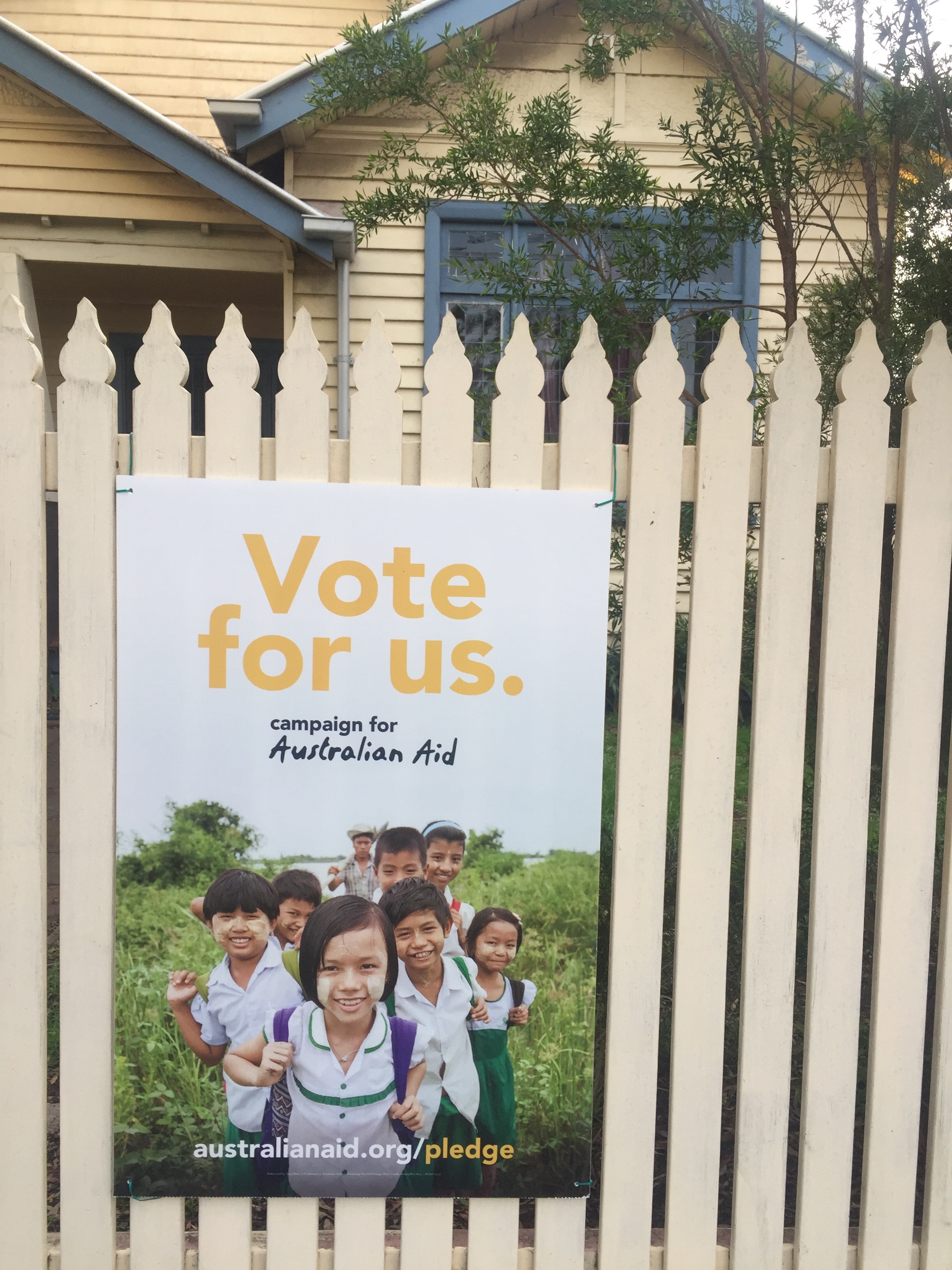 Vote For Us—the poster on my picket fence