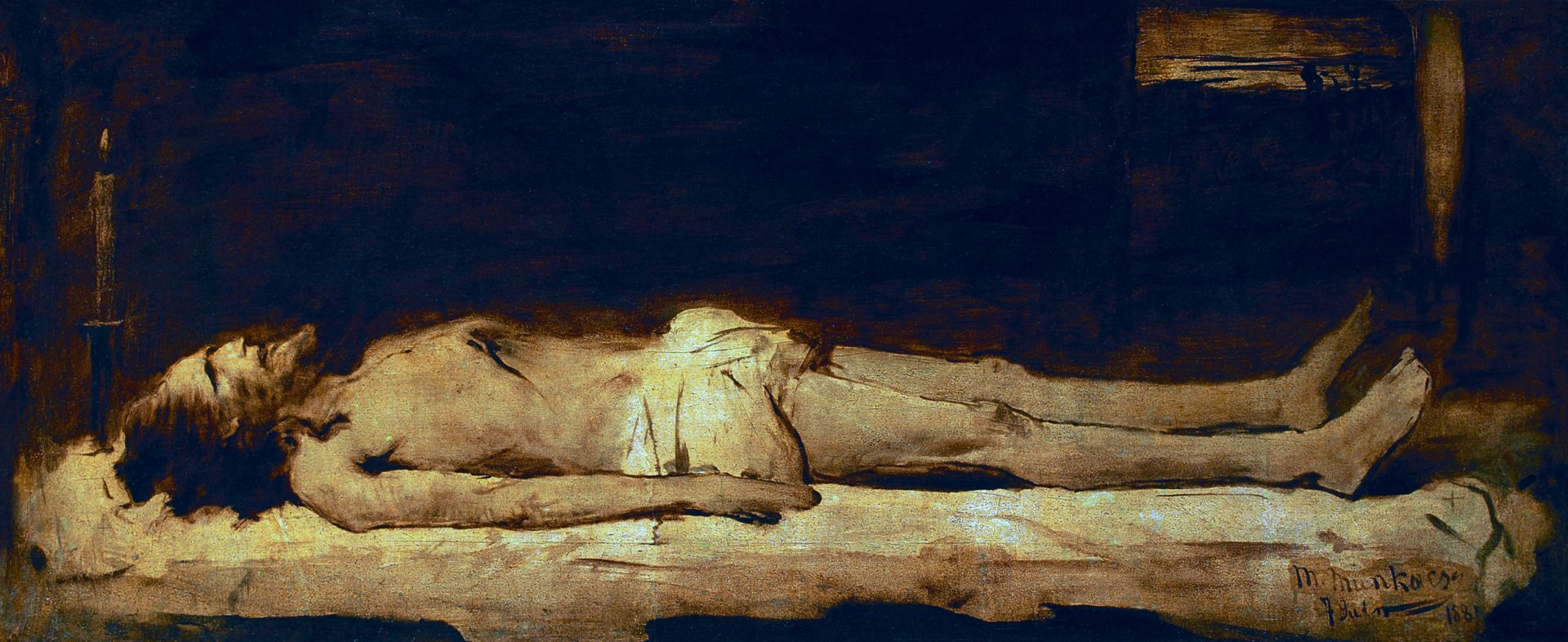 The corpse of a bearded man, in his mid 30s, wearing a loincloth, with a scar in his lower chest, lying on a rock surface in a dimly lit tomb.